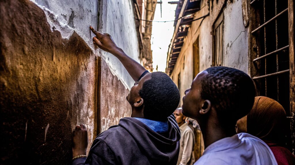 Why locals touch walls in zanzibar